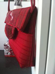 I padded out the magnetic closure to provide more room for the contents.  In my experience, too many bags look best when they have nothing in them!