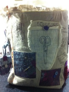 Non-specific pockets for packets of pins, buttons, bobbins etc plus a capacious one for the all important scissors!