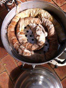 The coiled and bandaged sheet is put into the steamer over a hotplate for several hours.