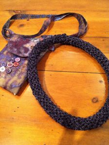 Purple necklace from a Teresa Dair kit (27% metal; 73% rayon).  Knitted.