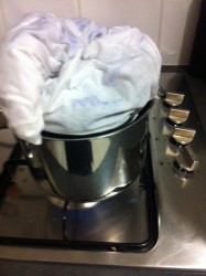 Very loosely piled into a sieve atop a saucepan of water