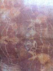 Silk wrapped tightly with brown onion skin and boiled for 30 minutes in tea flower solution.