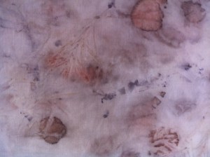 Iron sprayed Ilyarrie leaves on silk with a sprig of lavender .