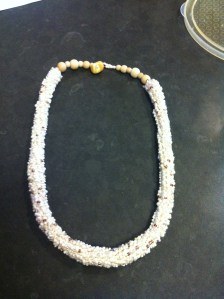 Crocheted beaded necklet in cream and light brown beads on cream embroidery cotton mixed with a cotton and linen mix thread. Beaded loop closure and stone fitting.